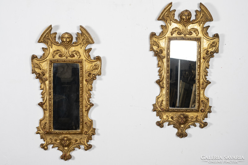 A pair of gilded wooden framed mirrors