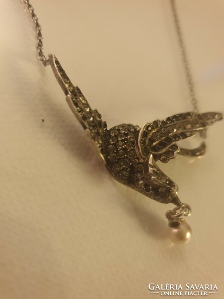 Silver necklaces with a beautiful bird