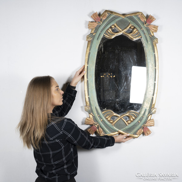 Gilded wood framed mirror with floral decor