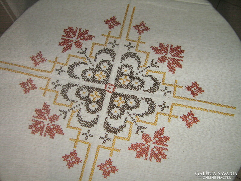 Beautiful antique hand-embroidered woven tablecloth with cross-stitch fringe