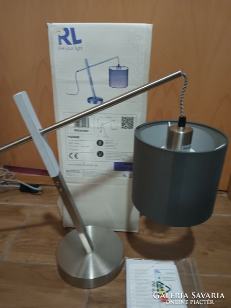 Modern design table lamp in a box. Negotiable.