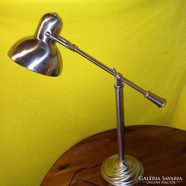 Chrome, tiltable, table or workshop lamp. It works.