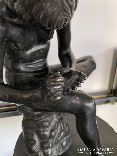 Antique bronze statue: boy pulling spikes
