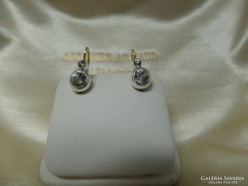 Antique gold buton earrings with a pair of white sapphires