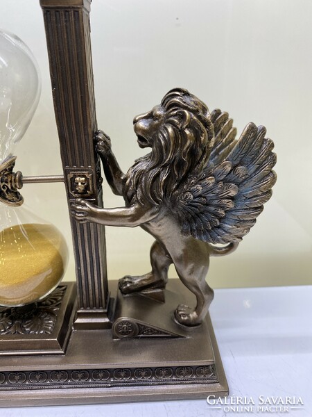 Bronzed lion hourglass sculpture