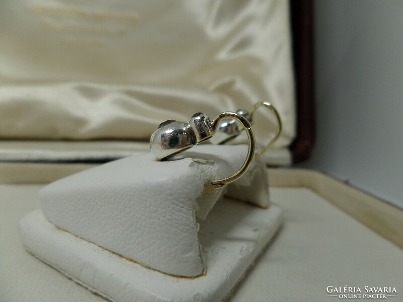 Antique gold buton earrings with a pair of white sapphires