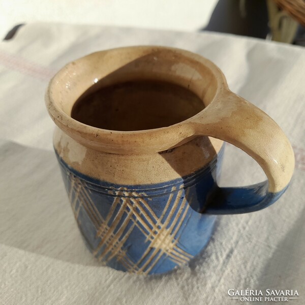 Antique glazed small earthenware tumbler with a handle