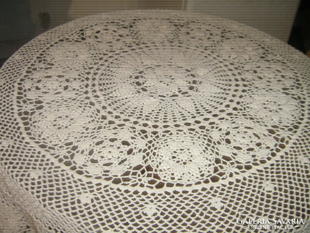 Beautiful antique ecru hand-crocheted round tablecloth with Art Nouveau features