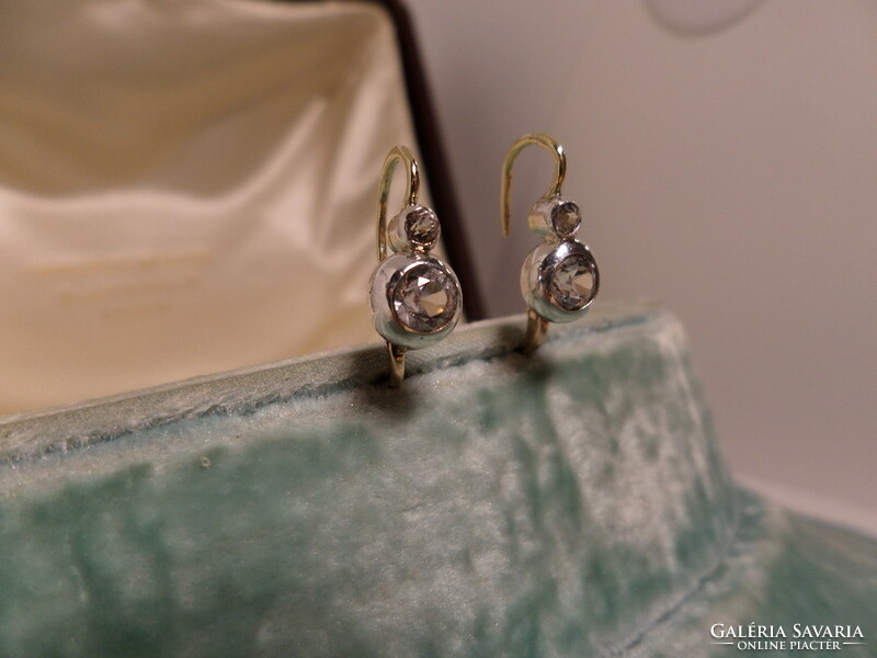 Antique gold buton earrings with a pair of white sapphires