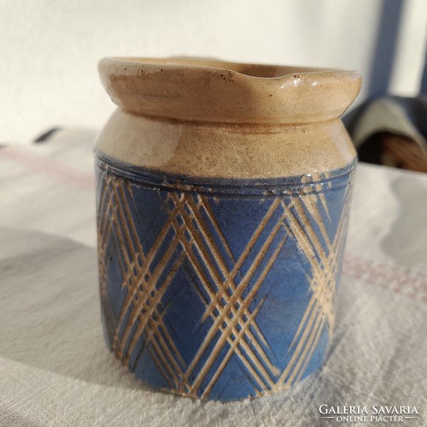 Antique glazed small earthenware tumbler with a handle