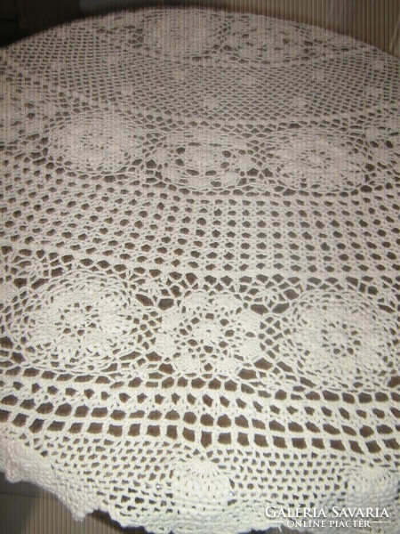 Beautiful antique ecru hand-crocheted round tablecloth with Art Nouveau features