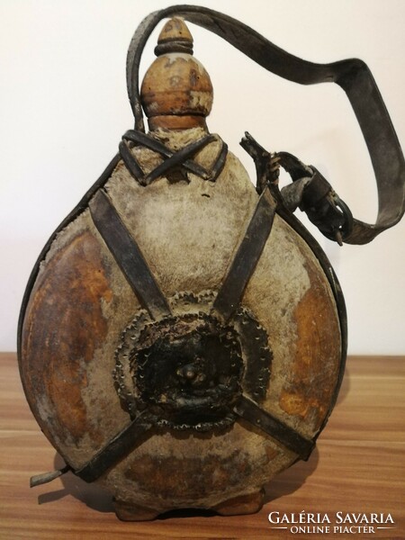 Antique horsehide water bottle.