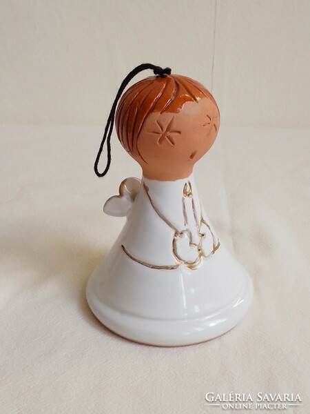 Glazed ceramic clay figurine, white angel statue holding a candle, ringing bell Christmas decoration