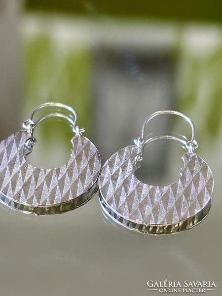 A pair of sparkling, art-deco-style cauldron earrings