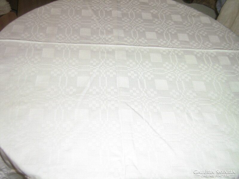 Beautiful antique snow-white checkered damask tablecloth