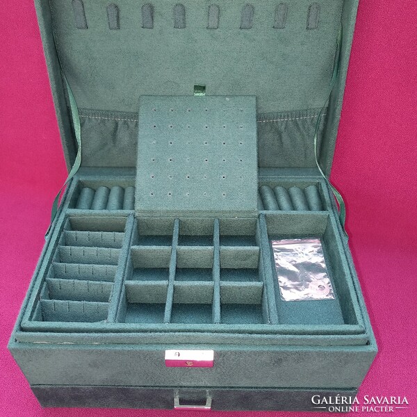 Lockable jewelry box with many drawers.