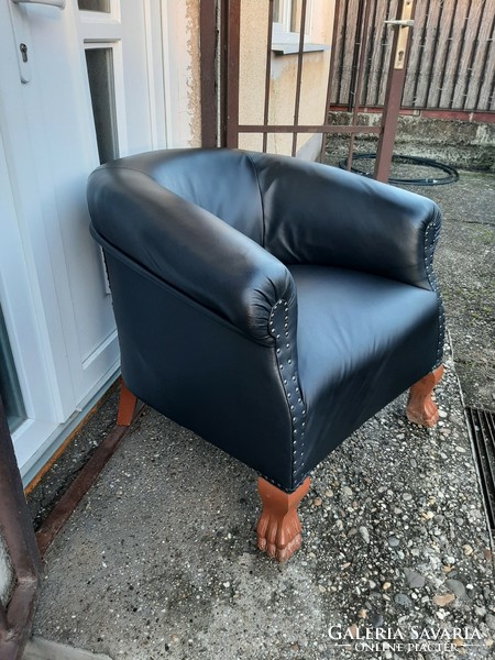 Very nice and comfortable refurbished leather armchair with lion legs