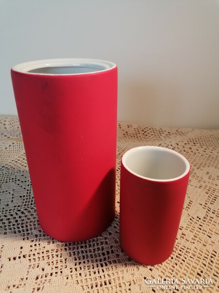 A pair of modern vases, with porcelain inserts on the inside, coated with some kind of rubber-like material on the outside.