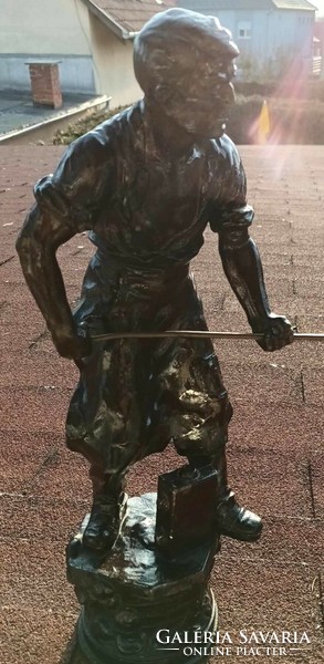 Huge tin - copper smelter worker statue