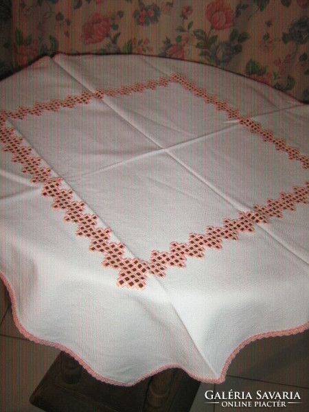 Beautiful and elegant white hand-crocheted tablecloth decorated with hand azure