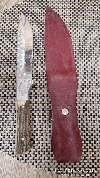 Old hunting dagger with saw.