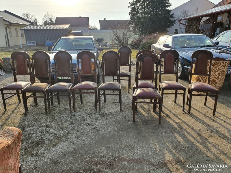 Antique, riveted, carved leather chairs.