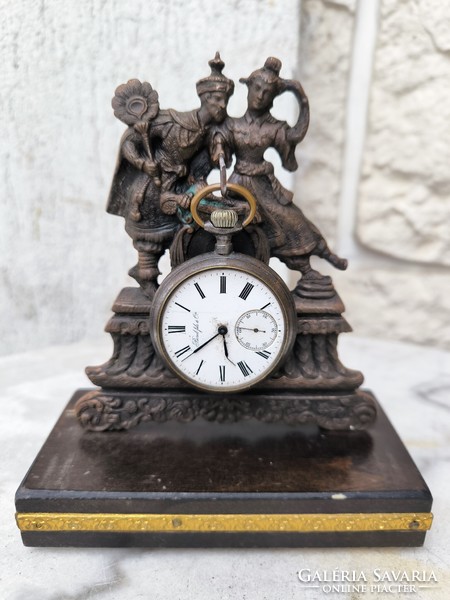 A beautiful figural bronze statue on a wooden base holding a pocket watch. Eastern Asian sculpture dancing figures