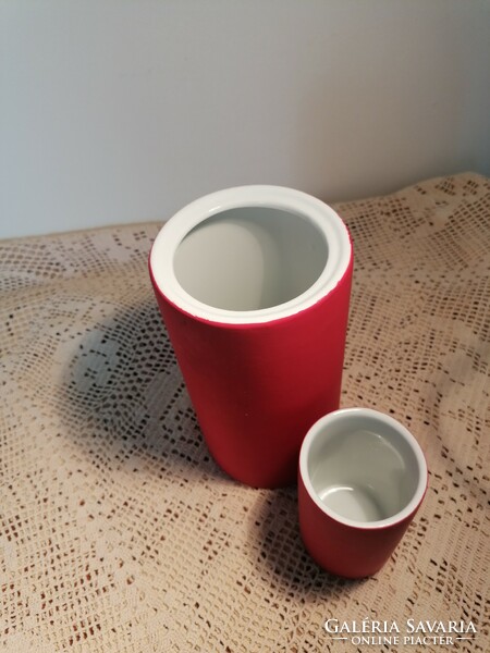 A pair of modern vases, with porcelain inserts on the inside, coated with some kind of rubber-like material on the outside.