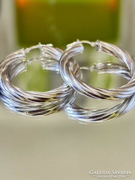 A pair of fabulous, shining silver hoop earrings