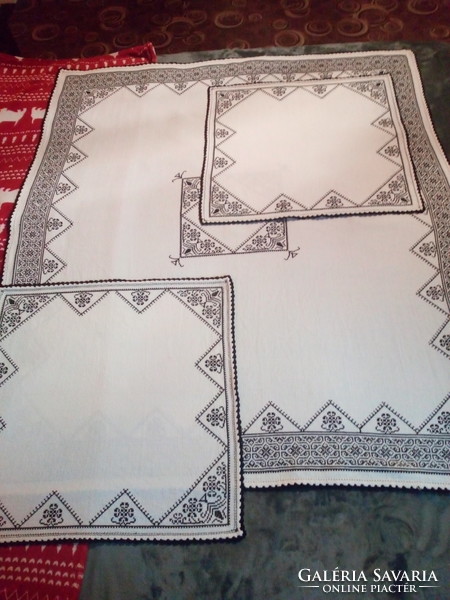 Antique cross stitch tablecloths.