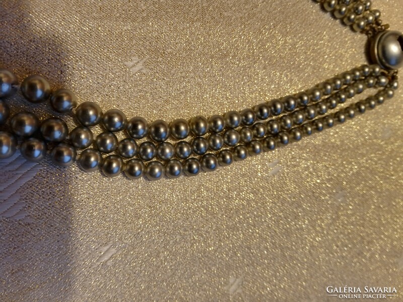 Vintage silver colored tekla pearl string.
