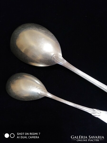Pair of silver (800) art nouveau pudding spoons.