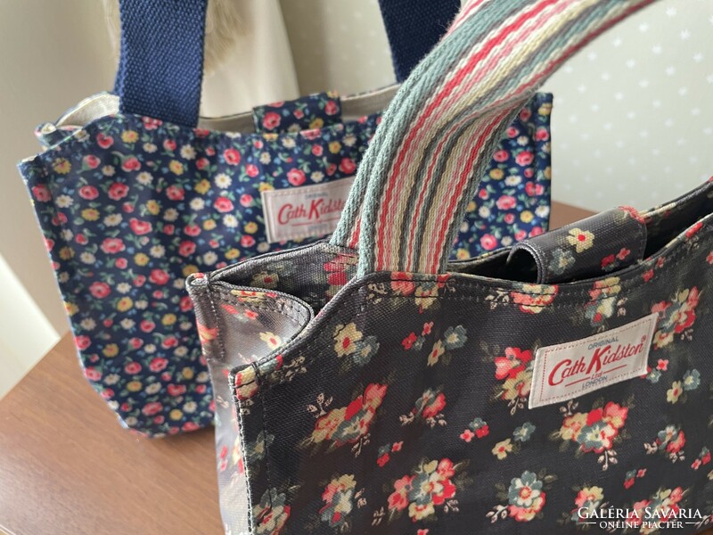 Cath kidston wonderful small floral oil clothes handbag on a blue background