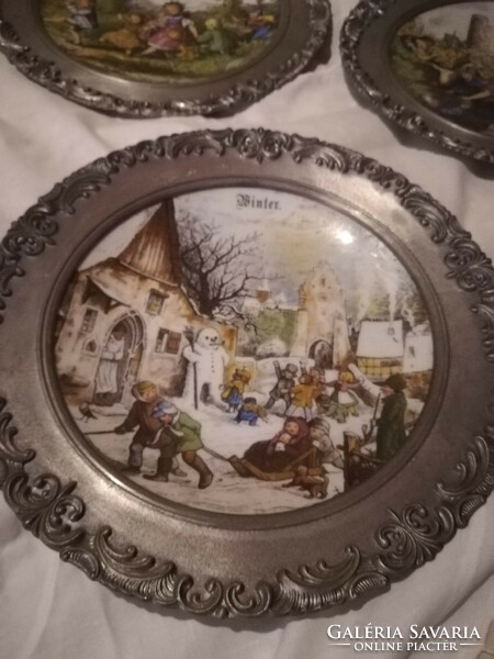 Seasonal porcelain plates in tin frames