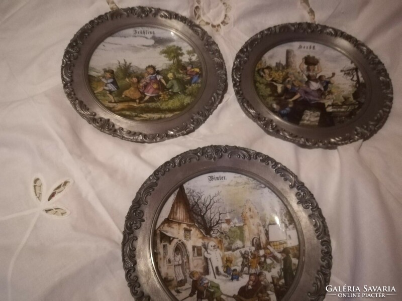 Seasonal porcelain plates in tin frames