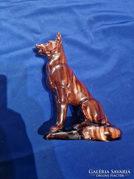 A brown-glazed ceramic figurine of a sitting dog?