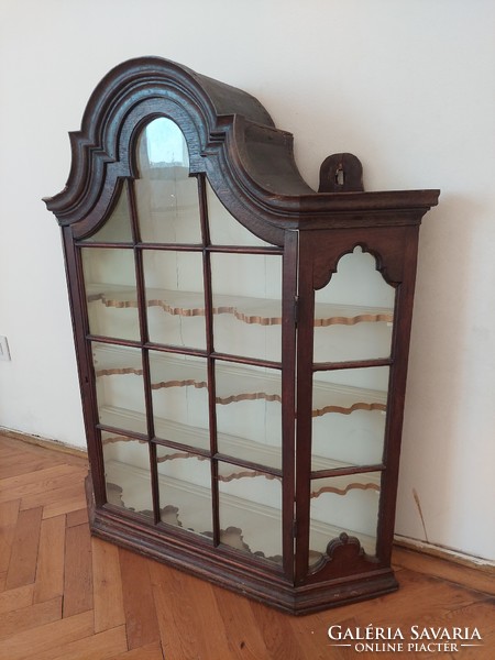 A wall display case with a baroque atmosphere
