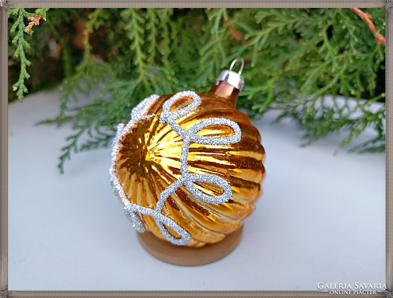 Old, gold base, bulging glitter patterned glass sphere ornament.