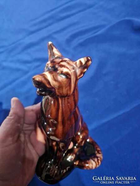 A brown-glazed ceramic figurine of a sitting dog?