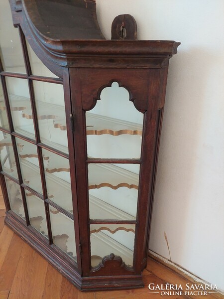 A wall display case with a baroque atmosphere