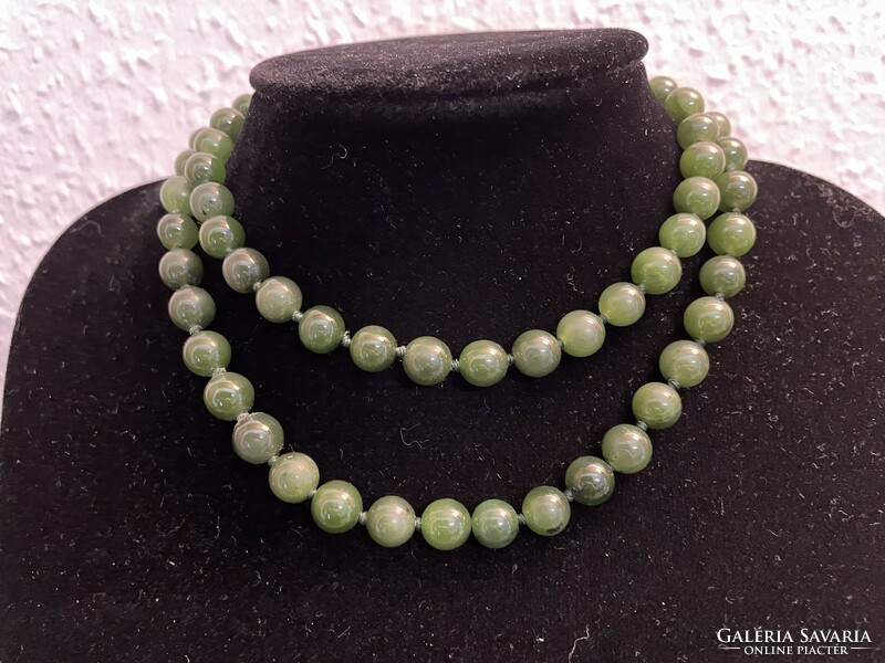 For sale is a truly antique jade necklace with original silver clasp and safety chain. Collector's item