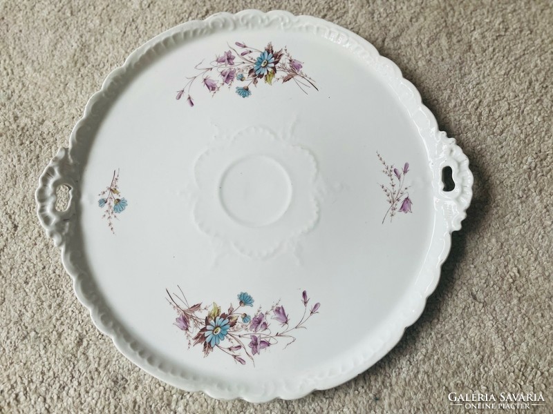 A giant porcelain cake serving bowl with a handle