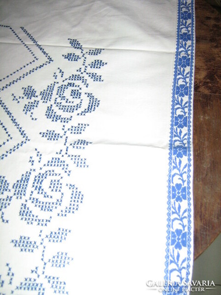 Beautiful hand embroidered blue rose on white tablecloth / wall cover