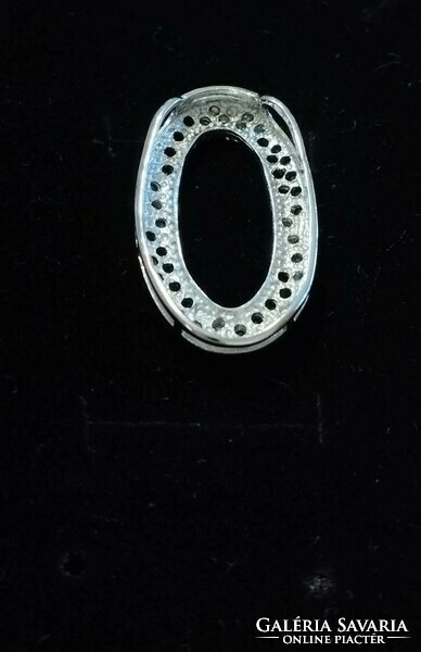 Silver oval pendant with black and white stones