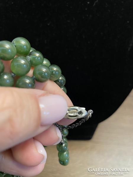 For sale is a truly antique jade necklace with original silver clasp and safety chain. Collector's item