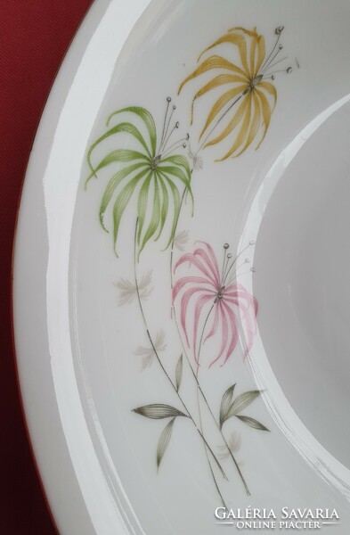 Porcelain bowl serving deep plate with a gold edge with a flower pattern soup garnish