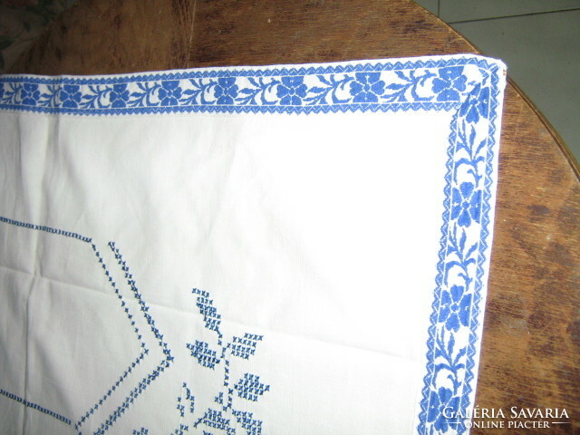 Beautiful hand embroidered blue rose on white tablecloth / wall cover