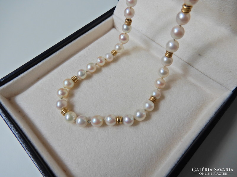 Old string of real pearls with 8 carat gold lock and diamonds