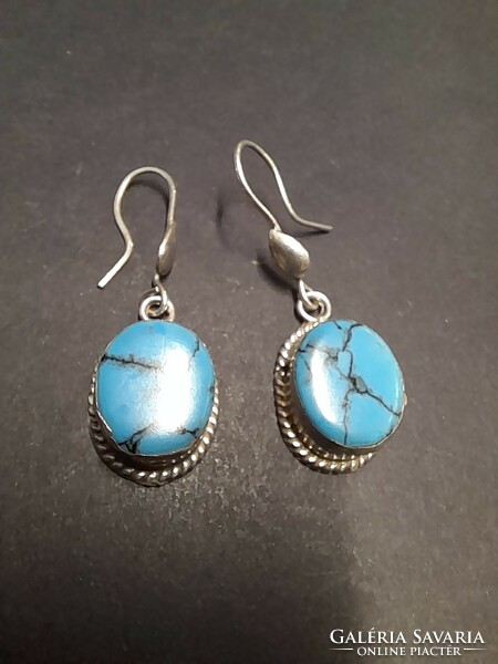 Pair of 925 silver earrings with turquoise stones.