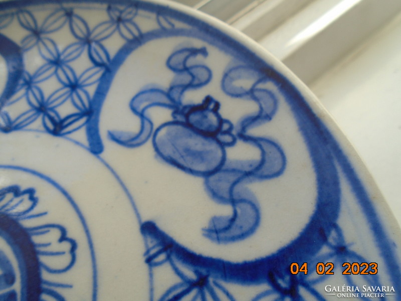 Antique hand-painted cobalt blue Chinese plate with calligraphic and geometric patterns